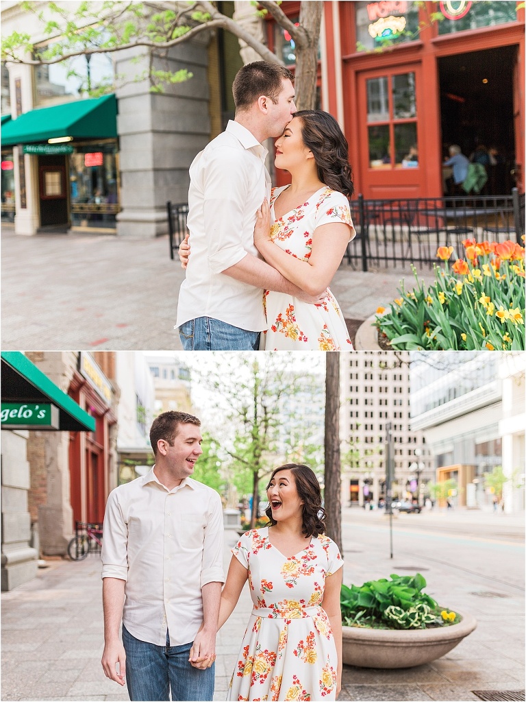An engagement session in downtown salt lake city. The couple is walking around holding hands, being in love, and kissing.