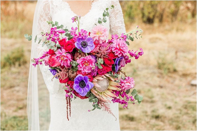 Beautiful floral bouquet with shades of pinks and purples by Lily and Juniper Blooms, captured by Ashley DeHart Utah Wedding Photographer