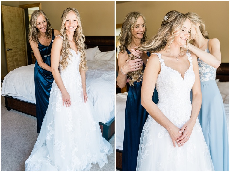 Mother zipper daughter into wedding dress