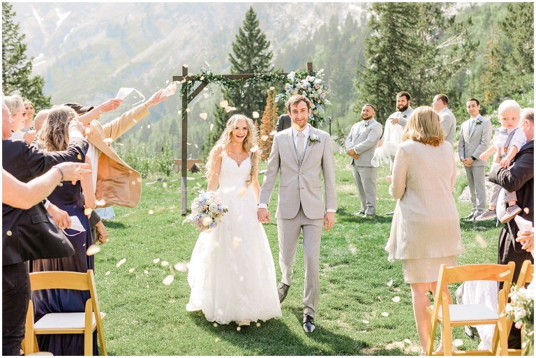 rose petal toss as the bride and groom walk down the aisle