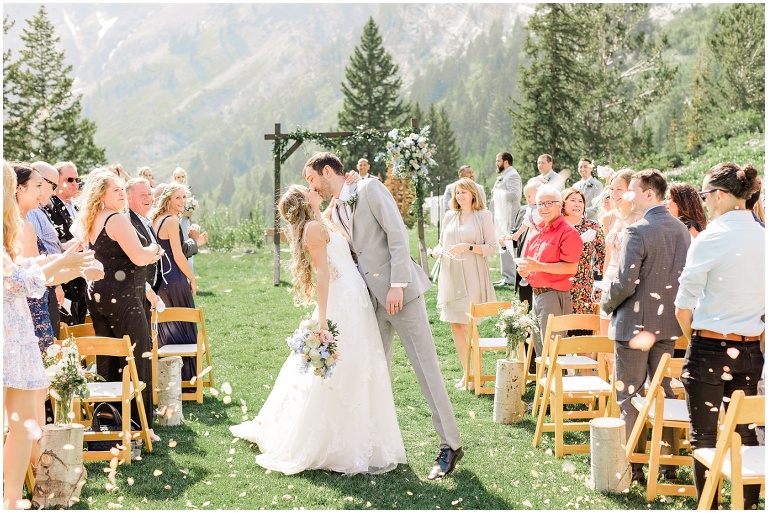 rose petal toss as the bride and groom walk down the aisle